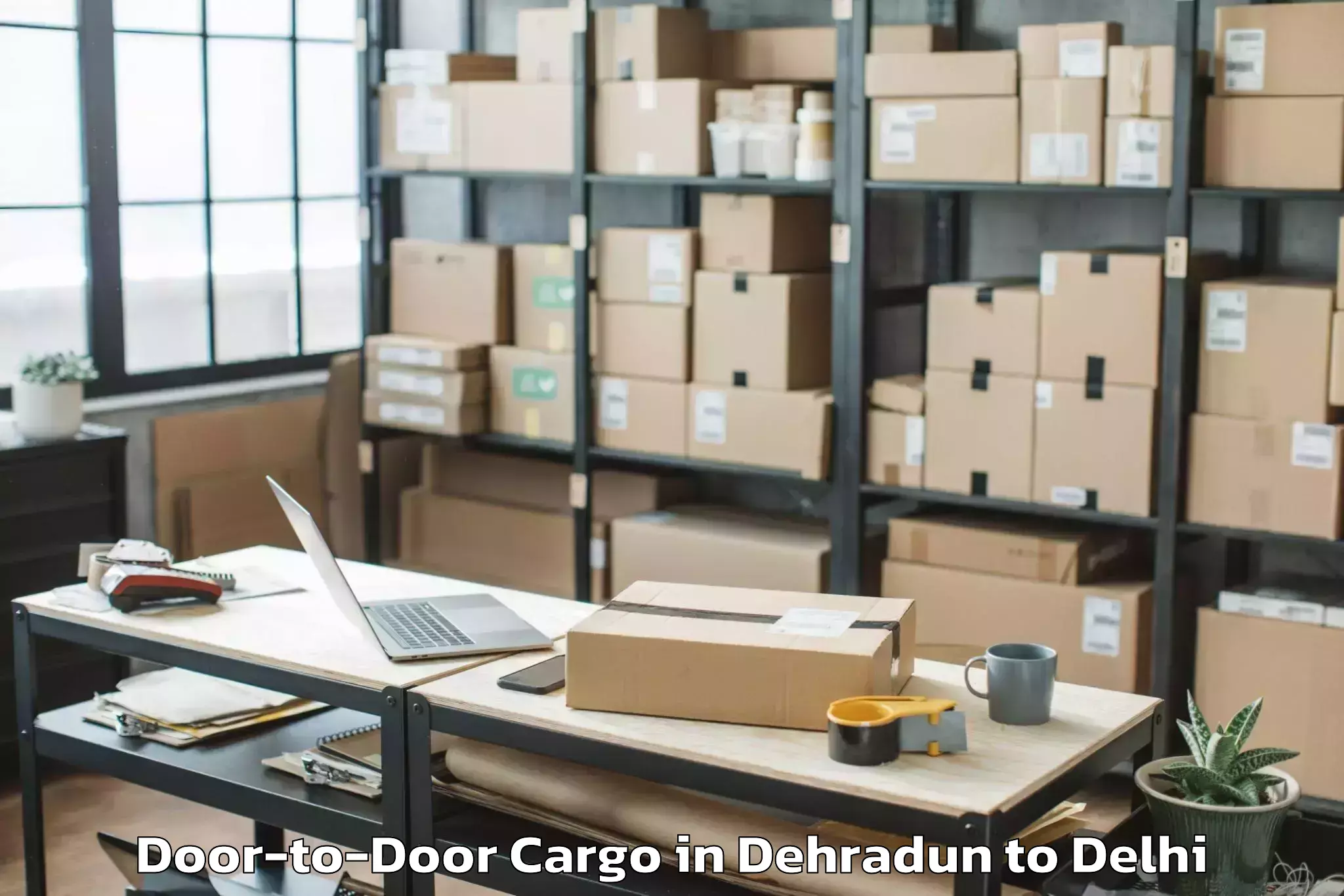 Top Dehradun to Unity One Mall Rohini Door To Door Cargo Available